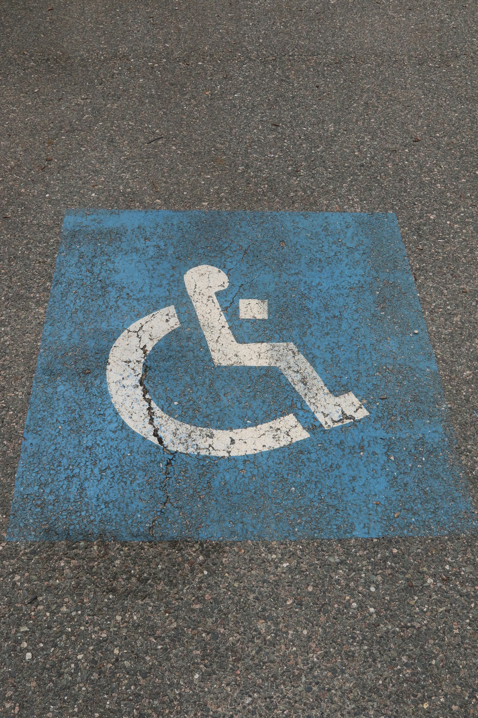 ADA parking lot striping: accessible space with the painted access symbol and marked aisle